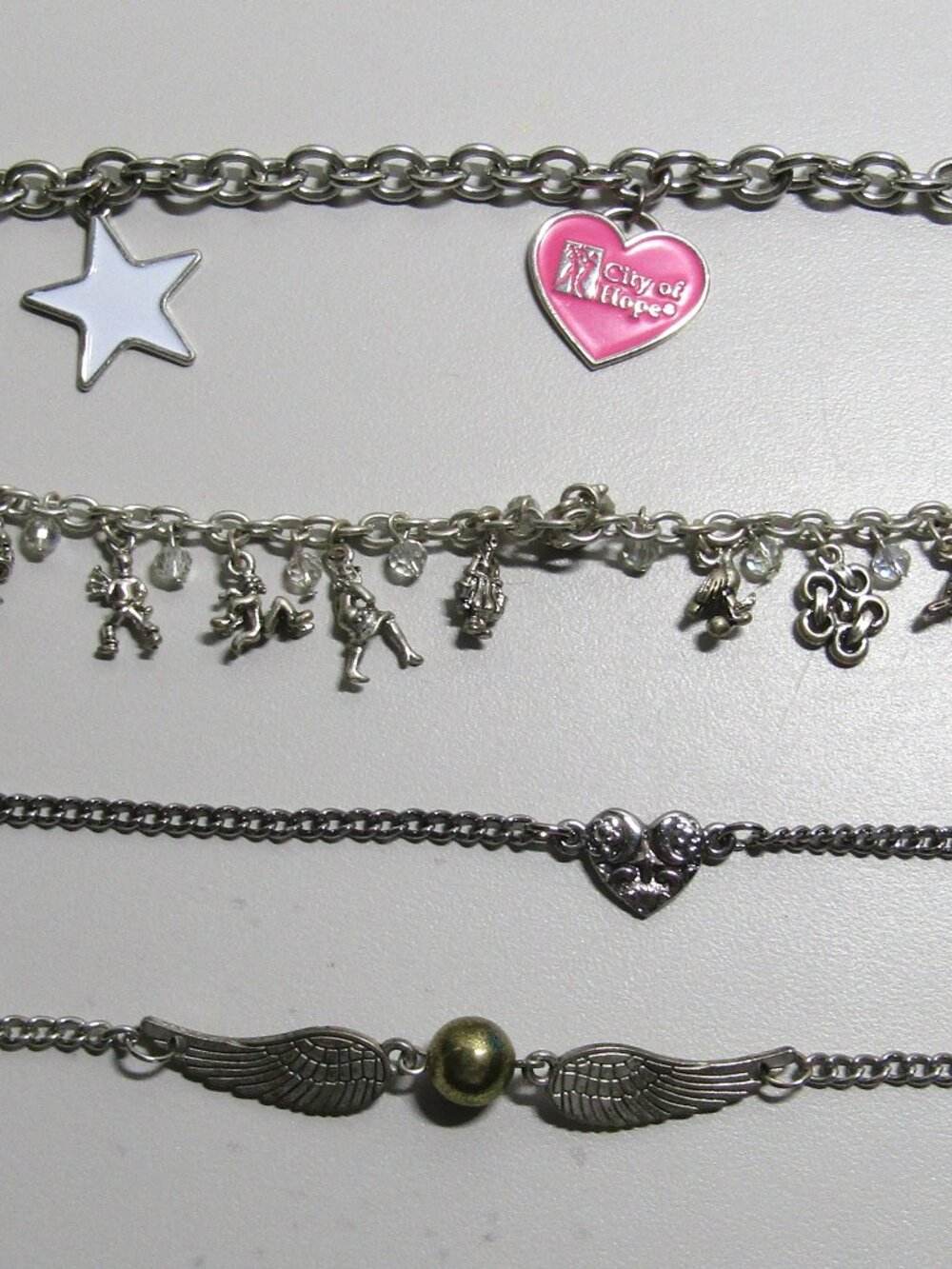 lot of 4 costume charm bracelets silver tone unmarked makers